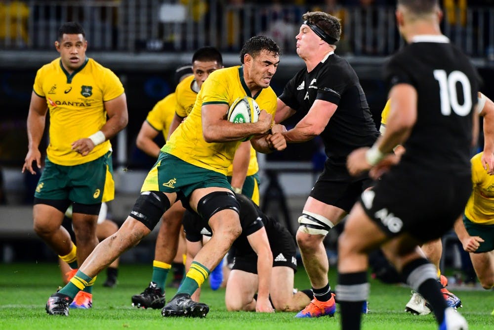 Rory Arnold takes a hit up in the Wallabies win over New Zealand. Photo: Stu Walmsley