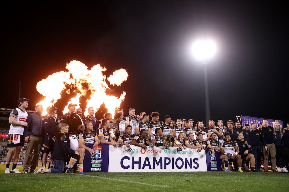 Brumbies hold up the Super Rugby trophy at GIO Stadium. Photo: Getty