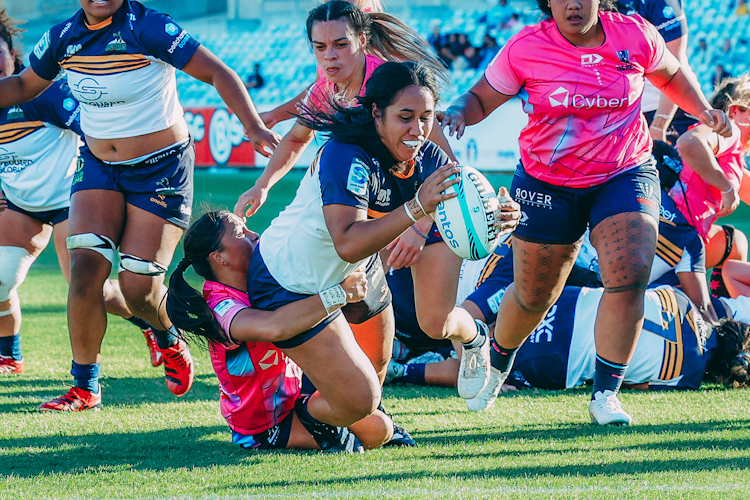 Tania Naden reaches out for a try in her side's win over the Rebels. Credit: Greg Collis