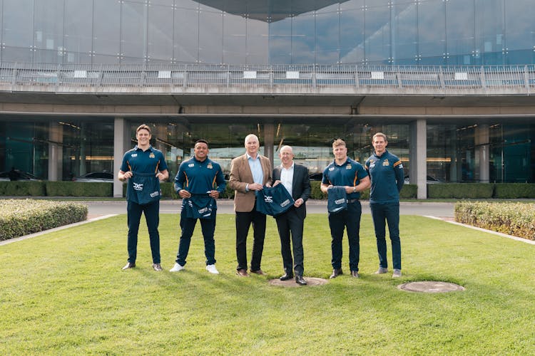 Safeguard Global ACT Brumbies Tom Hooper, Allan Alaalatoa, CEO Phil Thomson, Canberra Airport Group CEO Stephen Byron together with Harry Vella and Head Coach Stephen Larkham.