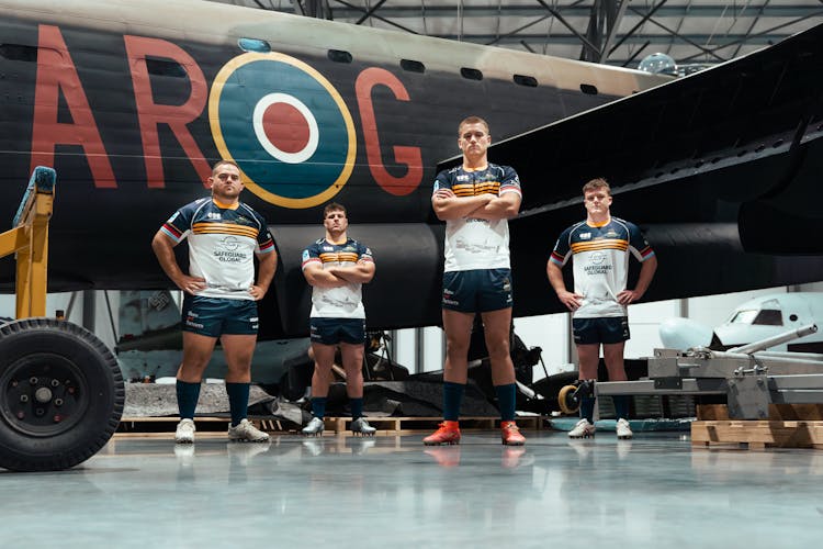 ACT Brumbies' Rhys van Nek, Harry Vella, Charlie Cale and Billy Pollard with the 'G for George' Avro Lancaster.